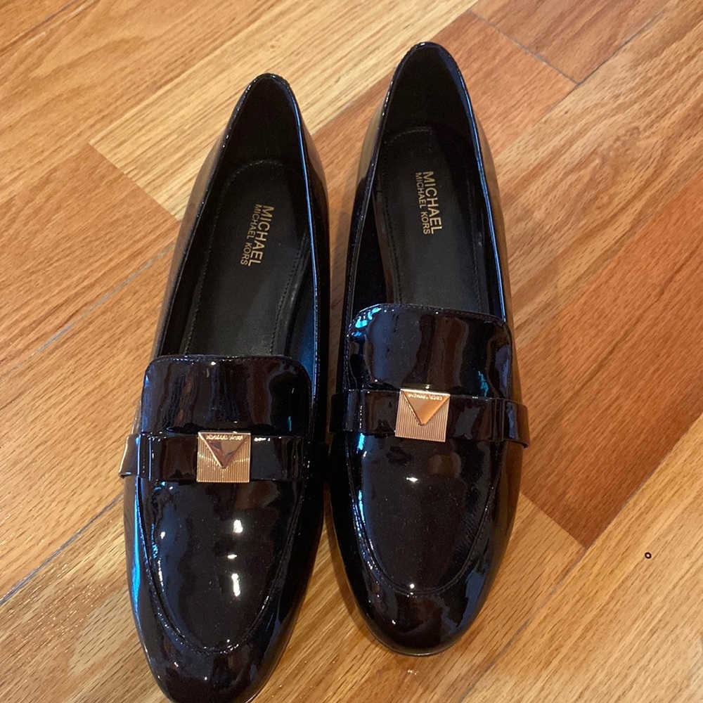Michael Kors black loafers with gold bow detail